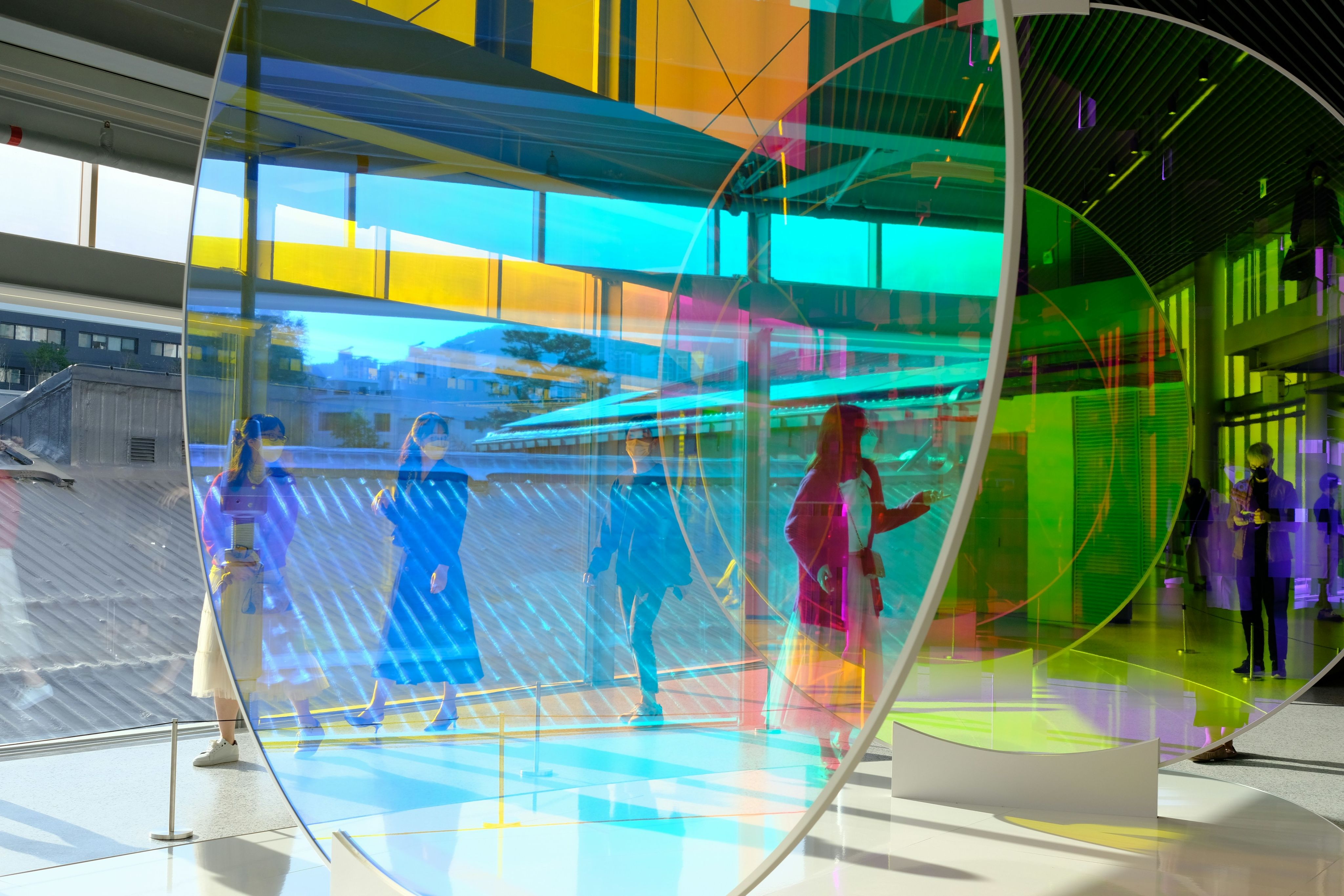 a group of people standing inside of a building
