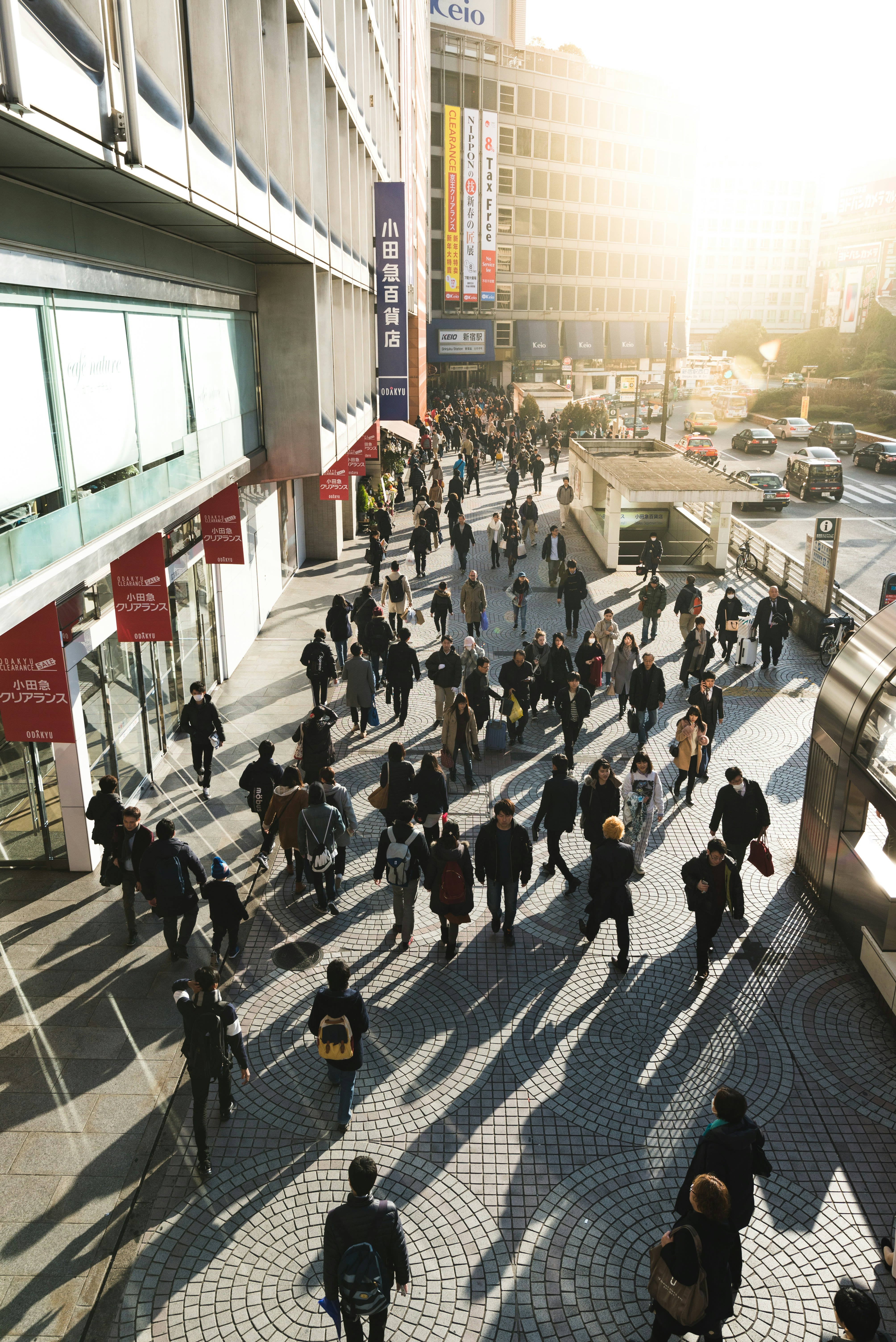 aerial photography of people walking on sidewalk near building during daytime